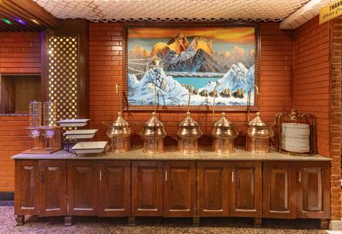 a counter in a building with a picture on the wall at Royal Boutique Hotel in Kathmandu