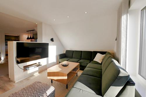 TV a/nebo společenská místnost v ubytování First-Class Fewo WANDER-LODGE in zentraler Lage!