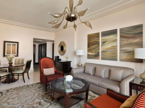 a living room with a couch and a table at Makkah Clock Royal Tower, A Fairmont Hotel in Makkah