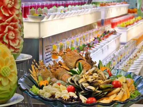 a platter of food on a buffet table at Makkah Clock Royal Tower, A Fairmont Hotel in Makkah