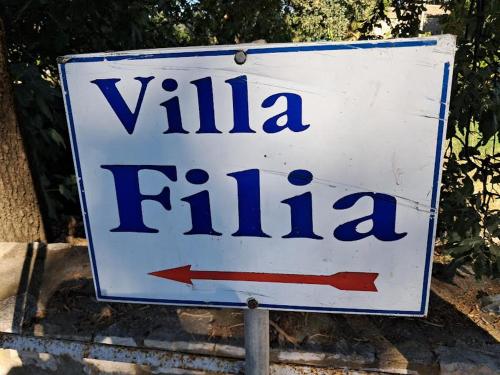a white sign that says villa fiji at Villa Filia in Almiros Beach