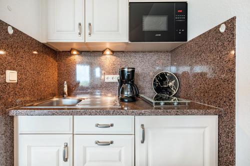 Kuchyň nebo kuchyňský kout v ubytování Apartementhaus Lord Nelson