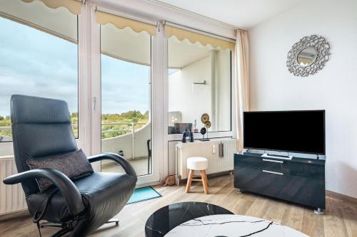 TV a/nebo společenská místnost v ubytování Apartementhaus Lord Nelson