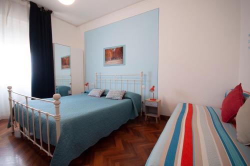 Ένα ή περισσότερα κρεβάτια σε δωμάτιο στο B&B Cento Passi Dalle Mura