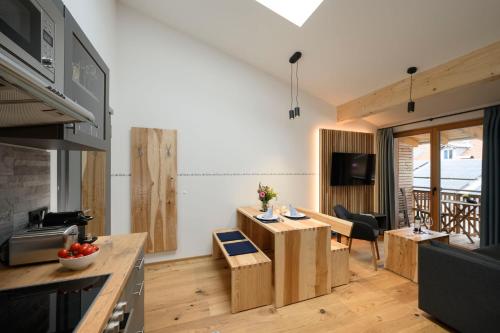 a living room with a kitchen and a dining room at Haus Sternenhimmel in Oberammergau