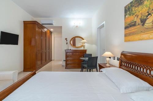 Ένα ή περισσότερα κρεβάτια σε δωμάτιο στο Villa Floyd Charming Rooms