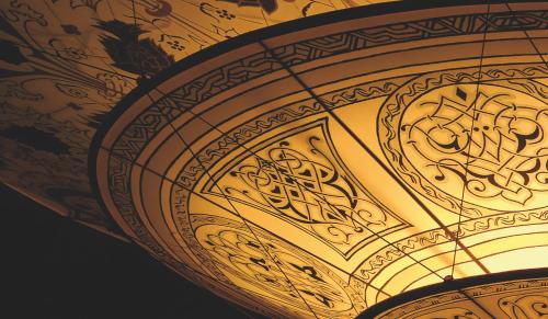 a close up of a gold object with writing on it at Hotel Casa Fuster G.L Monumento in Barcelona