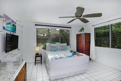 a bedroom with a bed and a ceiling fan at Big Island Retreat - No Resort Fees in Kailua-Kona