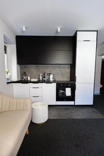 Kuchyň nebo kuchyňský kout v ubytování Apartment GREY Comfort