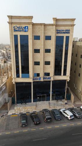 a parking lot in front of a building at بنزرت للشقق المخدومة in Al Hofuf