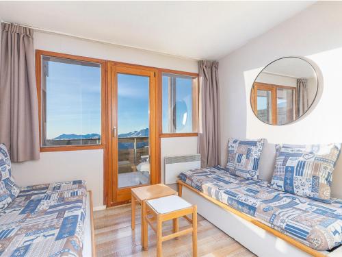 a bedroom with two beds and a mirror at Duplex 7 pers avec WIFI, balcon à Avoriaz - FR-1-314-246 in Morzine