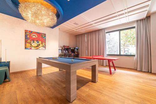 a living room with a pool table in it at Hotel Relax Family & Spa in San Benedetto del Tronto