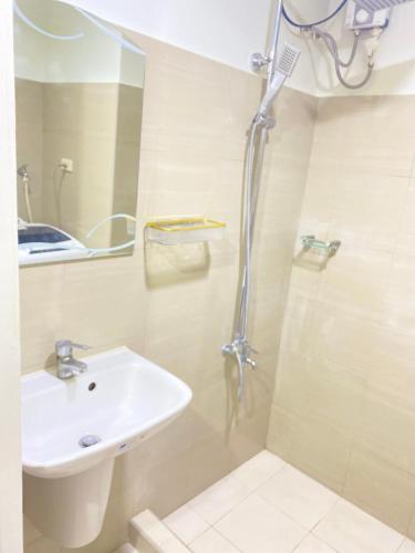 a bathroom with a sink and a shower at Shore 2 tower 2 in Manila