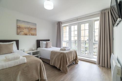 Ένα ή περισσότερα κρεβάτια σε δωμάτιο στο Riverside House