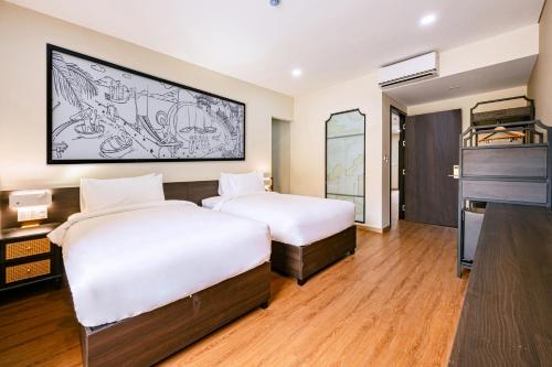 two beds in a hotel room with a piano at Hoi An Memories Resort & Spa in Hoi An
