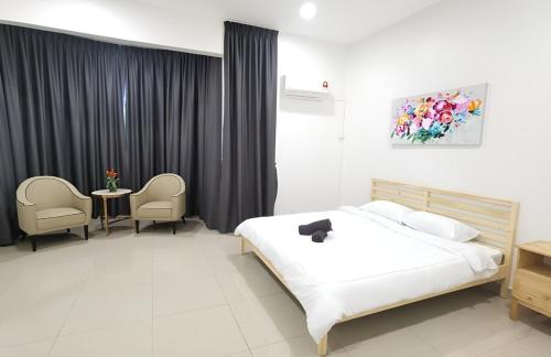 Ένα ή περισσότερα κρεβάτια σε δωμάτιο στο Shah Alam Homestay 7-10Pax