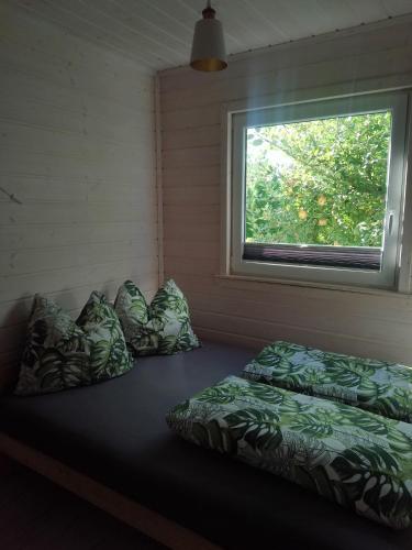 a room with two beds and a window at Las Palmas in Kołczewo
