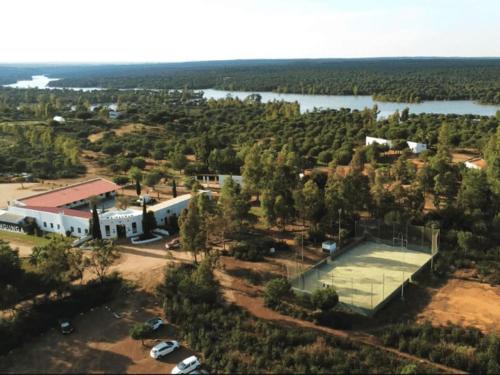 an aerial view of a building and a lake at Waingunga in Lepe