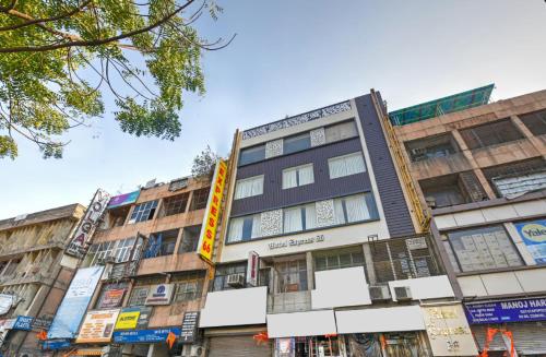 a row of buildings on a city street at Hotel Express 66 Just a Minute Away From New Delhi Railway Station Main Road in New Delhi