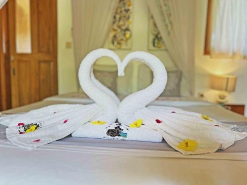Кровать или кровати в номере Lagoona Beach Bungalows - Eco Stay