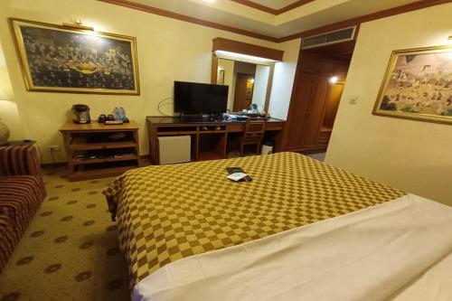 TV a/nebo společenská místnost v ubytování Taksila Hotel