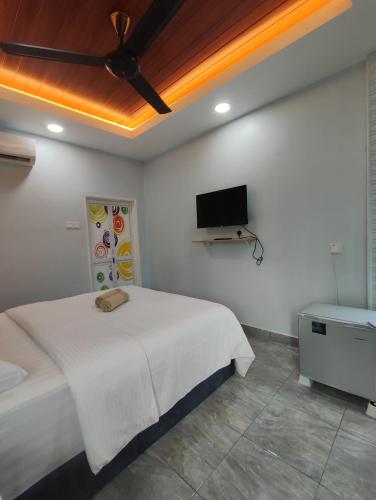 Ένα ή περισσότερα κρεβάτια σε δωμάτιο στο Ku's Roomstay 2 - Free Netflix & Wifi
