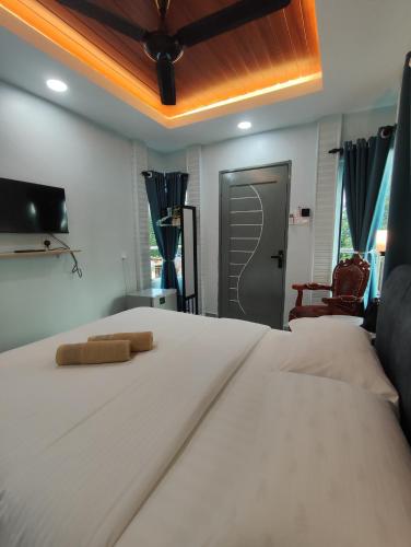 Ένα ή περισσότερα κρεβάτια σε δωμάτιο στο Ku's Roomstay 2 - Free Netflix & Wifi