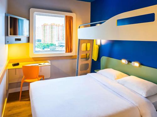 Postel nebo postele na pokoji v ubytování ibis budget Jundiai Shopping