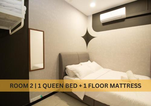 a small bedroom with a bed and a mirror at Neu Suites, 4 - 7 Pax, 4 Mins to KLCC in Kuala Lumpur