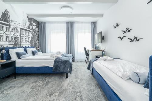 Una cama o camas en una habitación de ZAMEK NA PIASKU - Tuż przy Plaży