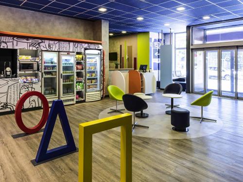 a store with chairs and tables and a a sign at ibis budget RJ Praia de Botafogo in Rio de Janeiro