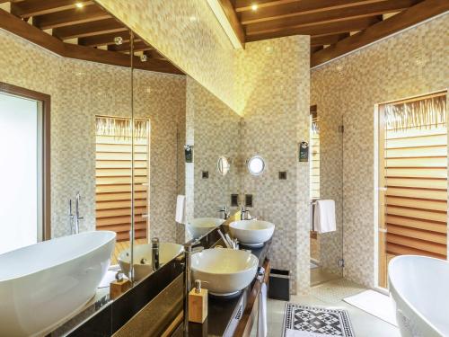 a bathroom with three sinks and a bath tub at Mercure Maldives Kooddoo - Adults - Only Escape - 50 percent off Transfers in Gaafu Alifu Atoll