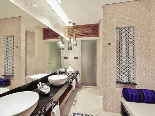 a bathroom with a sink and two sinks and a tub at Mercure Maldives Kooddoo - Adults - Only Escape - 50 percent off Transfers in Gaafu Alifu Atoll