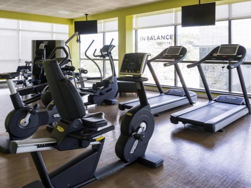 a gym with several treadmills and elliptical machines at Novotel RJ Porto Atlantico in Rio de Janeiro