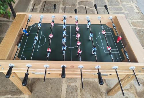 a hockey game in a wooden box with hockey sticks at Lebari in Bérriz