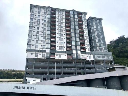 a tall building with a sign in front of it at CAMERON HIGHLAND CENRTUM BRINCHANG Homestay By Dcozy 6-7pax in Brinchang
