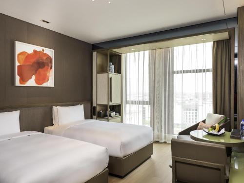 Katil atau katil-katil dalam bilik di Novotel Shanghai Clover