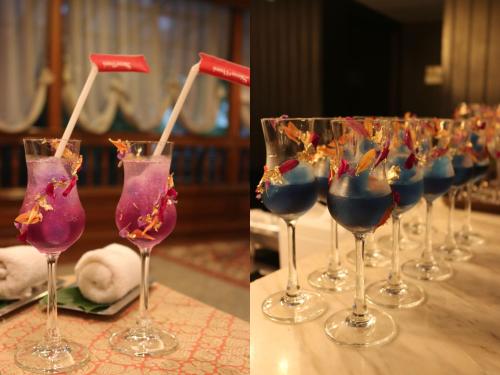 a row of wine glasses sitting on a table at Sima Thani Hotel in Nakhon Ratchasima
