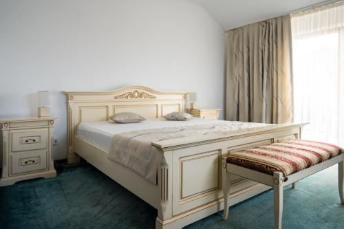 Voodi või voodid majutusasutuse Pensiunea Genesa toas