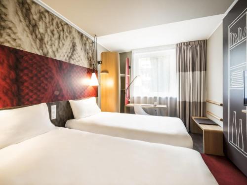 Cama o camas de una habitación en Ibis Gdansk Stare Miasto