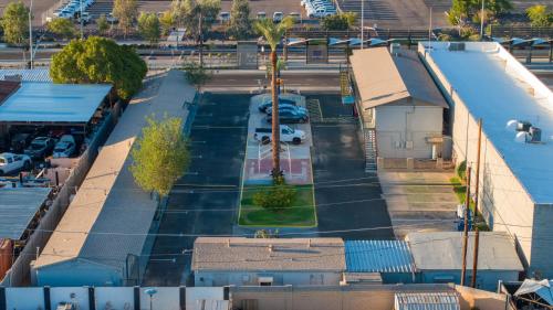 an aerial view of a parking lot with cars parked at Motel 7 By OYO Near Phoenix Airport in Mesa