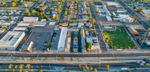an aerial view of a city with a parking lot at Motel 7 By OYO Near Phoenix Airport in Mesa