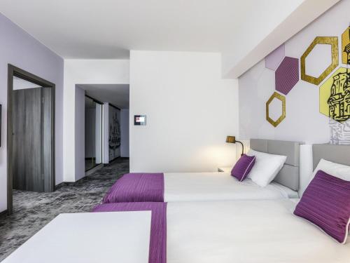 Postel nebo postele na pokoji v ubytování ibis Styles Nowy Sacz
