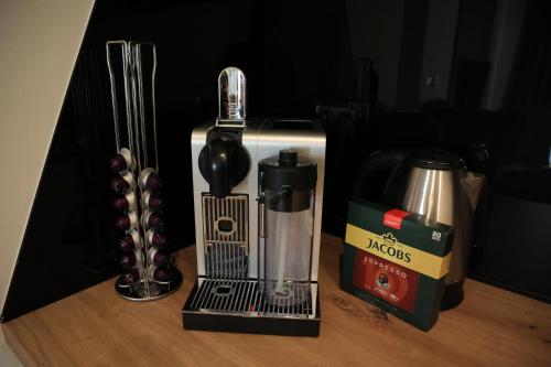 a blender sitting on top of a wooden table at Heaven Luxury Stay - Prime Location with Free Parking in Sarajevo