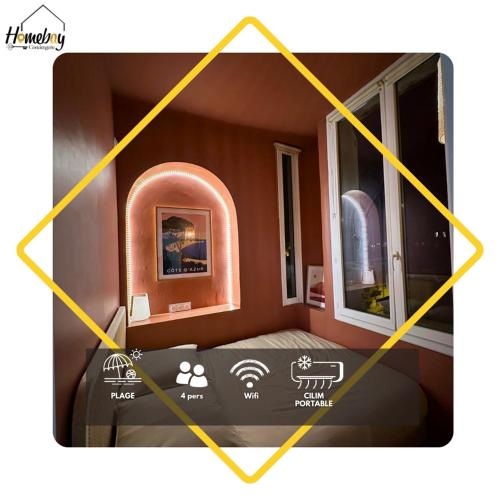 a room with a bed and two windows at Studio Cocon - Entièrement rénové - 4 couchages - 600m de la Gare de Cannes in Cannes