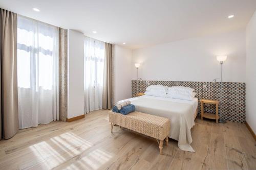 Giường trong phòng chung tại Quinta do Linharinho