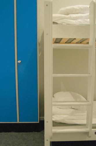 Una cama o camas en una habitación de Grad Hotel and Hostel