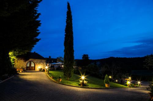 a driveway leading to a villa at night at Agriturismo Casa VolaterrA in Volterra