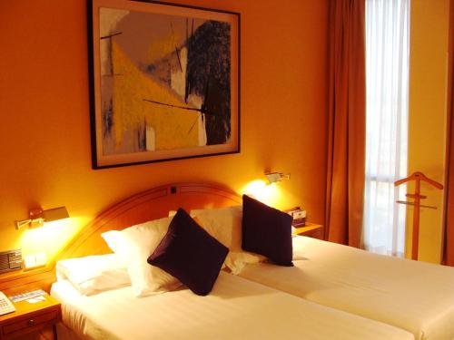 Ένα ή περισσότερα κρεβάτια σε δωμάτιο στο Hotel Majadahonda