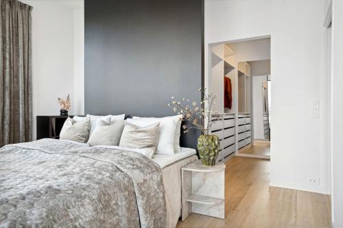 Ένα ή περισσότερα κρεβάτια σε δωμάτιο στο TotalApartments Northern Lights Penthouse